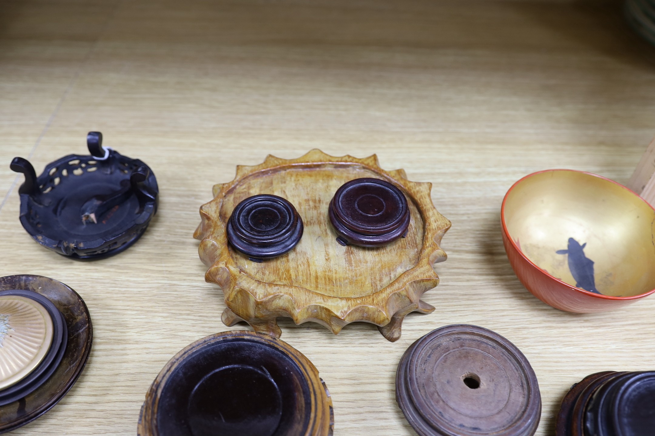 Assorted Chinese wooden stands and a lacquer bowl
